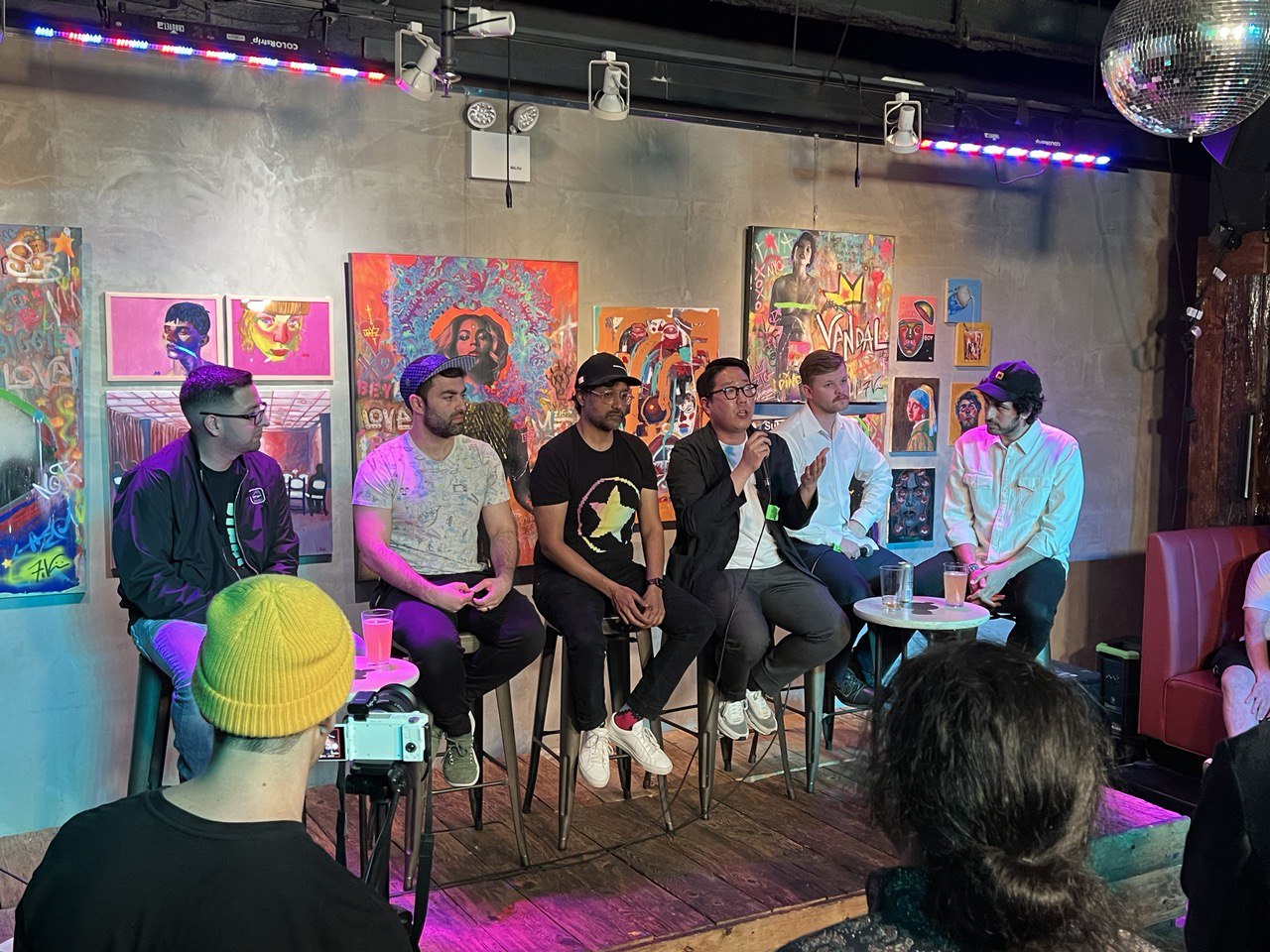 A picture of a panel of six people speaking
