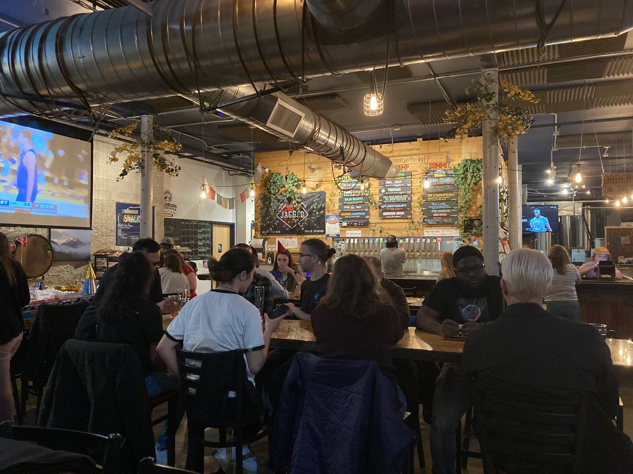 A picture of attendees networking around a table.